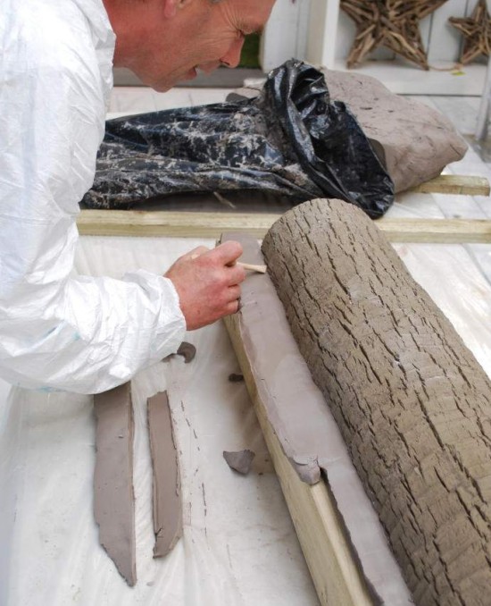hand crafting an artificial tree trunk